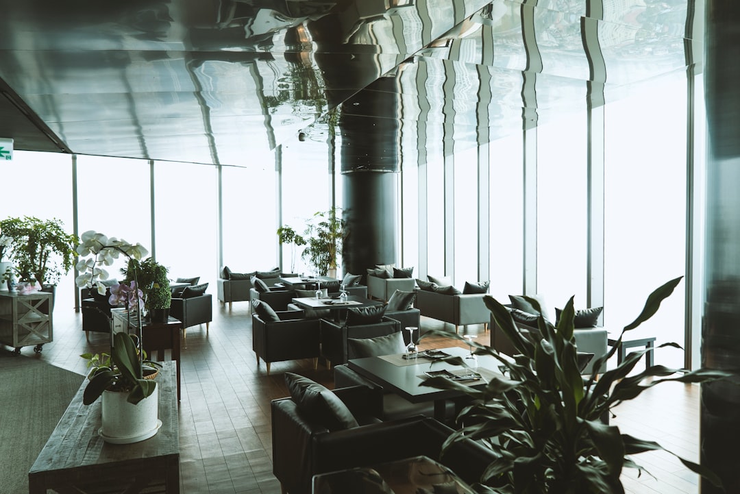 black-wooden-tables-and-chairs-inside-building-6yhwfmej5by